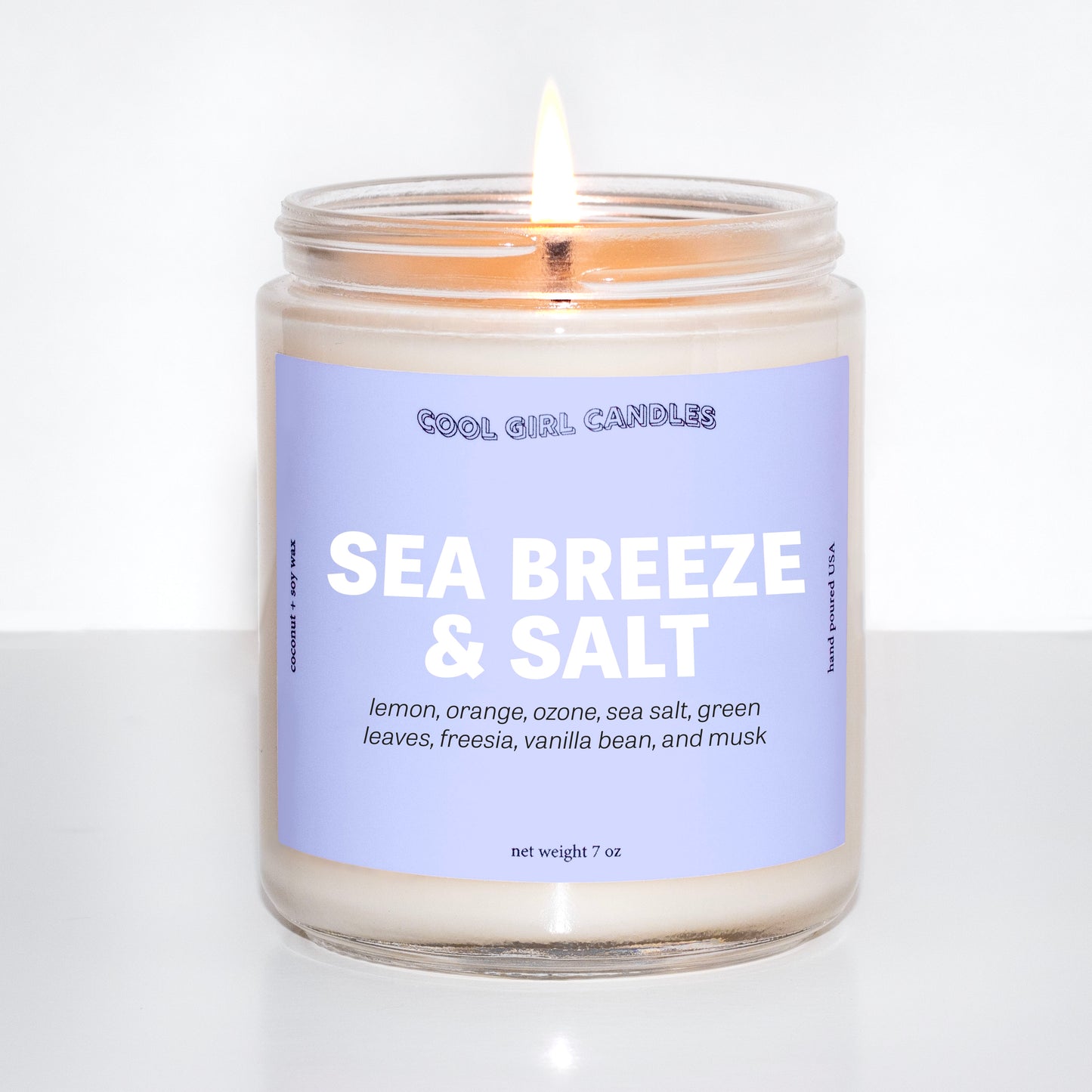 sea breeze and salt candle by cool girl candles is a coastal seaside inspired candle with notes of lemon, orange, sea salt, and ozone. This candle smells zen and calming like a coastal seaside escape.