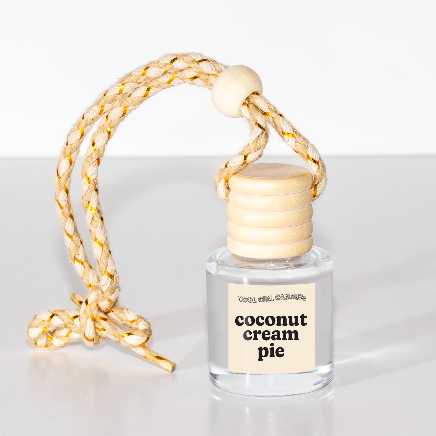 coconut cream pie scented car freshener hanging by cool girl candles