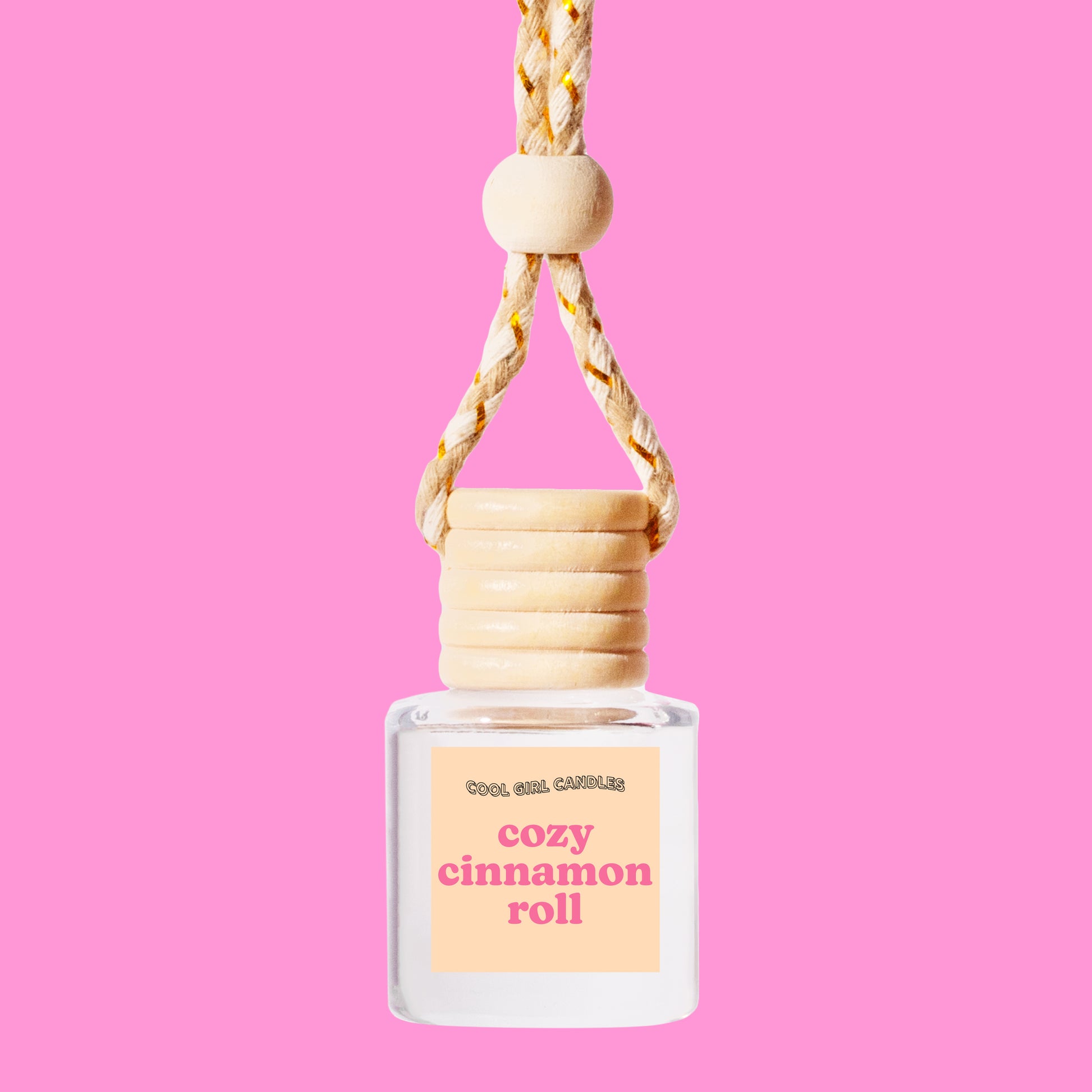 Cozy Cinnamon Roll holiday scented car freshener bottle made by cool girl candles