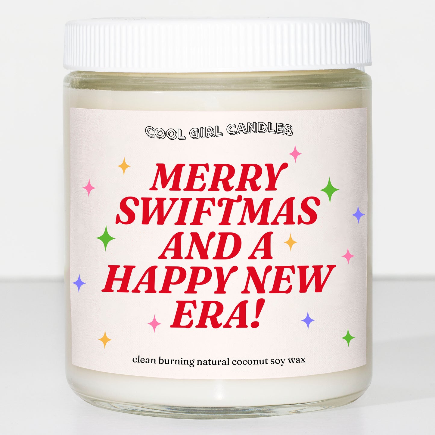 Taylor Swift holiday candle that says Merry Swiftmas and a Happy New Era made by cool girl candles