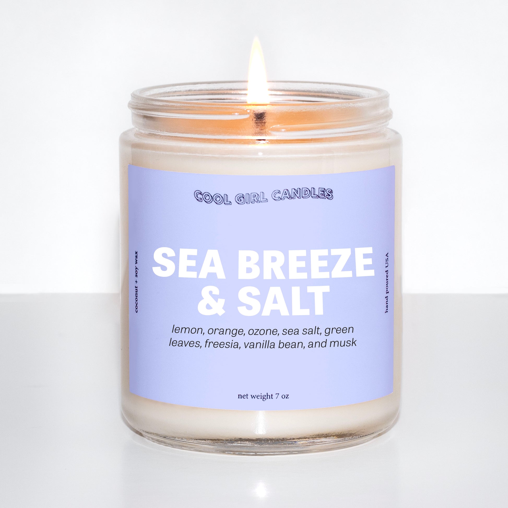 sea breeze and salt candle by cool girl candles is a coastal seaside inspired candle with notes of lemon, orange, sea salt, and ozone. This candle smells zen and calming like a coastal seaside escape.