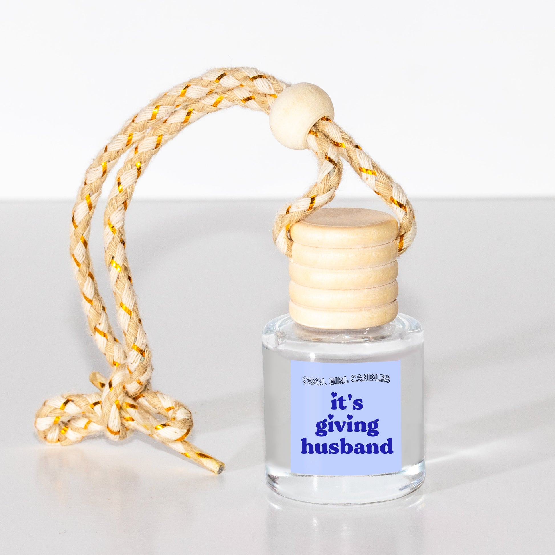 hanging scented car freshener gift for husband and groom that says it's giving husband