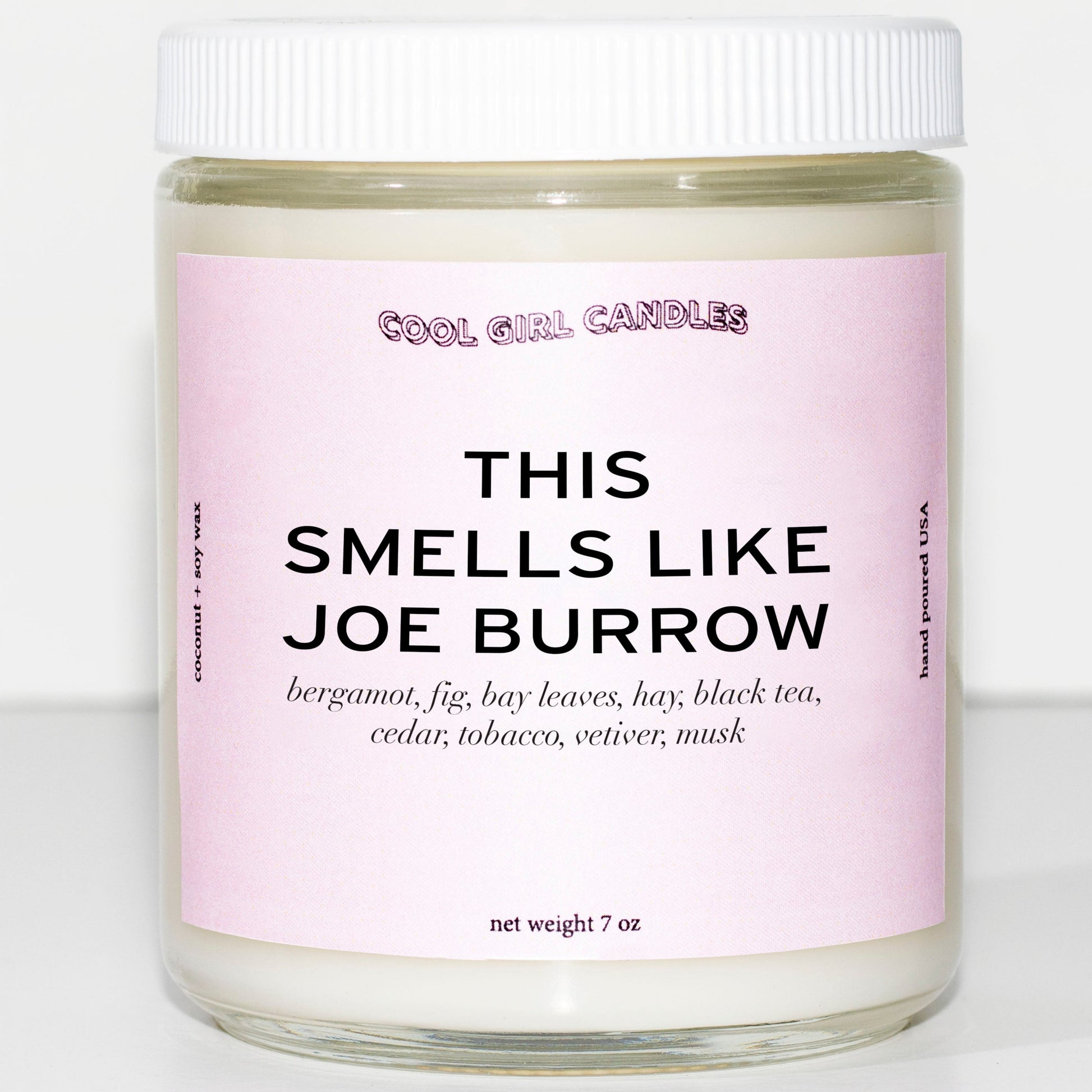 A pastel pink candle that says this smells like joe burrow from cool girl candles. A sports gift for anyone who loves joe burrow, the Cincinnati Bengals quarterback football player 